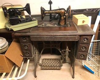 this vintage singer sewing machine with cabinet and wrought iron base is gorgeously ornate and YOU NEED THIS