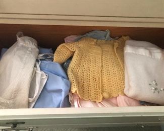 oh, c'mon, cute li'l vintage hand-knitted baby clothes? This is melting my crusty heart