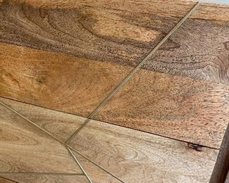 Roar & Rabbit™ Geo Inlay 6-Drawer Dresser   for West Elm   Overall: 54"w x 16"d x 34"h.  
Mango: Solid raw mango wood. Shiny Brass-finished metal details and legs.
Bone: Kiln-dried solid wood frame in a Bone finish. Metal legs and details in a Silver finish.  Made in a Fair Trade Certified™ facility, directly benefiting the workers who make it.
The mango wood used on this product is sustainably sourced from trees that no longer produce fruit.
Wood finish is natural and may vary slightly.
Drawers open from the side on angled metal glides.
Anti-tip kit hardware (included) is highly recommended to provide protection against tipping of furniture.