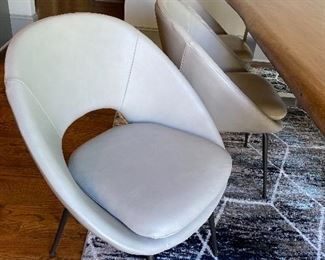 West Elm  Orb Leather Dining Chair  Round out your dining room in modern style with our Orb Leather Chair. Featuring a cutout back, its curved, scooped-back frame offers an inviting seat perfect for drawn-out dinner parties.

This contract-grade item is manufactured to meet the demands of commercial use in addition to residential. See more.
24.25"w x 22.5"d x 31.6"h.