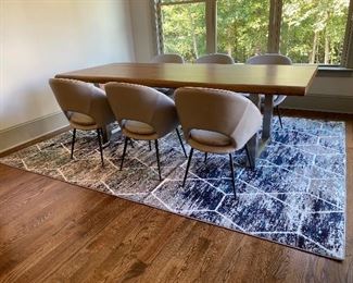 West Elm  Orb Leather Dining Chair Round out your dining room in modern style with our Orb Leather Chair. Featuring a cutout back, its curved, scooped-back frame offers an inviting seat perfect for drawn-out dinner parties.

This contract-grade item is manufactured to meet the demands of commercial use in addition to residential. See more.
24.25"w x 22.5"d x 31.6"h.