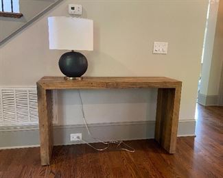 West Elm Emmerson  Bridge Table    Rustic meets relaxed. Made from unfinished reclaimed pine certified to Forest Stewardship Council® (FSC) standards, the Emmerson® Console shows the knots and natural imperfections that make each piece subtly one of a kind.

KEY DETAILS
54"w x 15"d x 31"h.
Made with FSC®-certified wood from responsibly managed forests.
Solid reclaimed pine  comes from a variety of sources, including shipping pallets and packing crates.