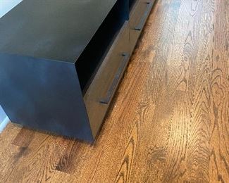 West Elm Massarro Media Console  68"w x 16"d x 20"h.
Oak veneer over solid wood drawers in an Umber finish.
Metal case and hardware in a Hot-Rolled Steel finish.