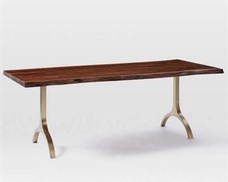 West Elm Live Edge Cast Trestle Dining Table   Cast Trestle Dining Table's richly-grained acacia wood top gives it a rustic feel, while its live edges make each one subtly one of a kind. We dressed up its spacious surface with wishbone-shaped trestle legs in your choice of burnished bronze or antique brass finishes. I
86"w x 36"d x 30"h.
Solid acacia wood top in a Burnished Amber finish.