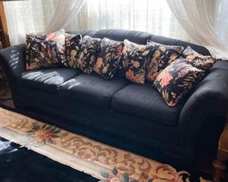 Black 3-Seat Sofa, Floral Throw Pillows