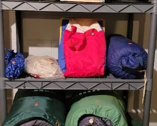 Sleeping bags, camping gear, red coleman cooler