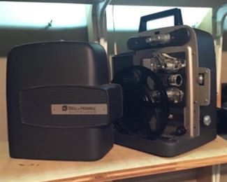 and another Bell & Howell Movie Projector
