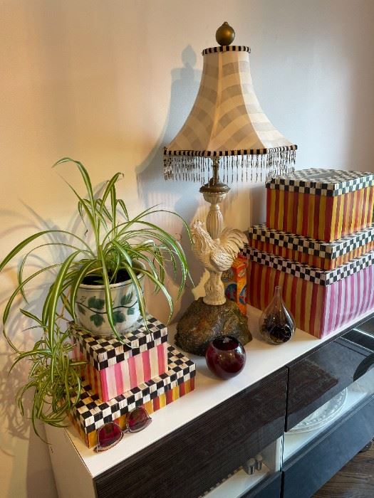 An Asian Rooster on a modern cabinet.  Some MacKenzie Childs handpainted boxes