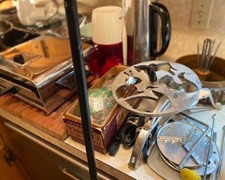 Press of some sort, perculator, vintage flat toaster, dazey grinder