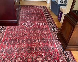 One of four oriental area rugs