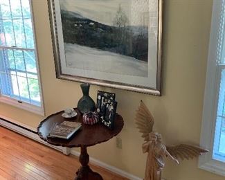 Living Room 
Large Gordon Muck Watercolor, tall wooden Angel, tilt top table, mosaic frames, art glass