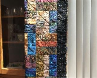 quilted throw with cat fabric on reverse