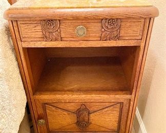 Antique Marble Top Bedside Cabinet with Carved Top Drawer and Sliding Bottom Drawer. Brass Hardware. Measures 32" tall x 16" wide x 16" depth.