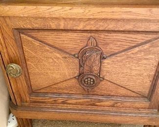 Additional photo of carving on bedside cabinet.