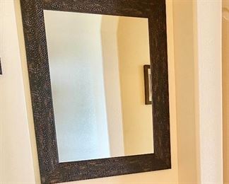 Hammered Metal Framed Mirror. Measures 29" wide x 35" length.