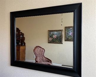 Large Wooden Framed Beveled Mirror. Measures 57 1/2" wide x 45 1/2" length.