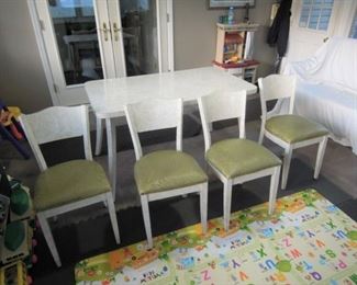 $400 obo -Very nice mid century modern formica kitchen table with center leaf and four chairs.  Table top , legs, chair backs and legs all covered in original formica. All pieces and cushions in very good to excellent original condition.  