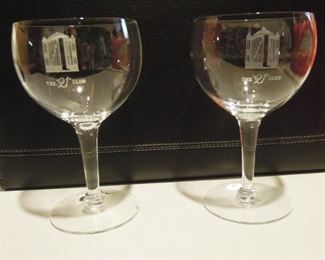 $80 obo -21 Club iron gate wine glasses, both have minute flea bite chips at base.
