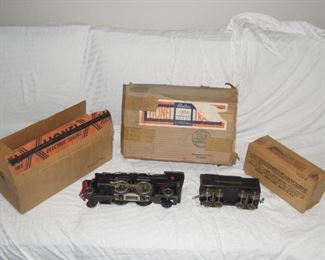 $550 obo -Lionel prewar standard gauge #1835 locomotive with #1835T tender. Both inside boxes good, master carton ok with one end flap set missing. Engine runs well, e unit cycles correctly, firebox bulb working, headlight not working. Tender has the common bowing, not real bad but is noticeable.