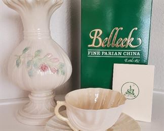 Belleek vase (signed by artist) and scallop tea cup and saucer set.