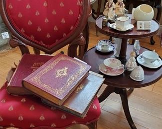 Antique carved rosewood boudoir chair, Antique books, Sandicraft large Dalmation door stop, tea cups, lovely 2 tear mahogany antique table