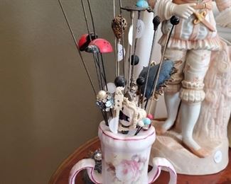 Antique hat pin holder with antique hat pins