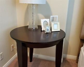 Round wood side table, glass table lamp