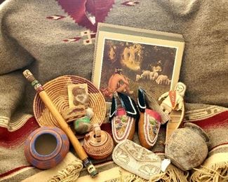 Vintage wool poncho rug, Mexican and NA pottery, antique beaded moccasins, Santa Fe Railroad "Indian" prints