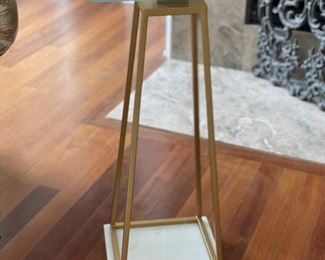 Uttermost gold metal side table with carrara marble base. Measures 10" x 10 x 23" H.