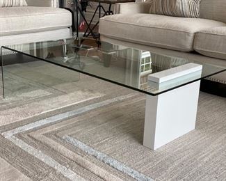Buono high glass white lacquer coffee table with waterfall edge. Measures 50" W x 27" D x 14.5" H. Photo 1 of 2.