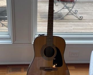 Fender acoustic guitar with stand. Photo 1 of 3.