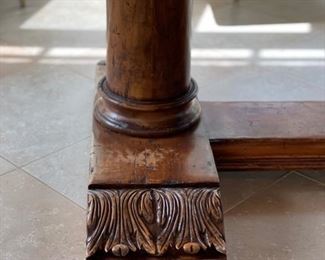 Custom Ironies dining table with travertine top and hand-carved wood pedestal base. Measures 90" W x 60" D x 31" H. Photo 3 of 4.