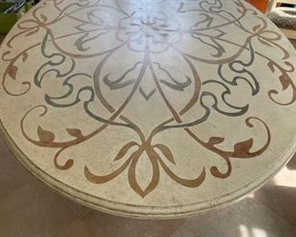 Custom Ironies dining table with travertine top and hand-carved wood pedestal base. Measures 90" W x 60" D x 31" H. Photo 1 of 4.