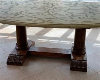 Custom Ironies dining table with travertine top and hand-carved wood pedestal base. Measures 90" W x 60" D x 31" H. Photo 2 of 4.