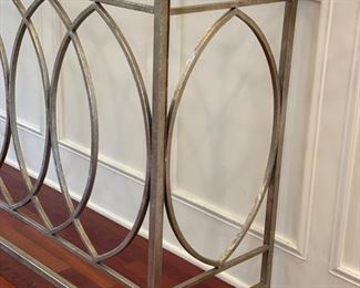 Uttermost gold metal console with glass top. Measures 60" W x 16" D x 36" H. Photo 2 of 2.