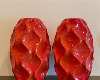 Pair of decorative orange vases. Each measures 17" H.