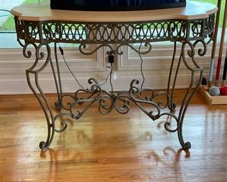 Travertine-topped wrought iron console. Measures 48" x 26" x 41" H. Photo 1 of 2.