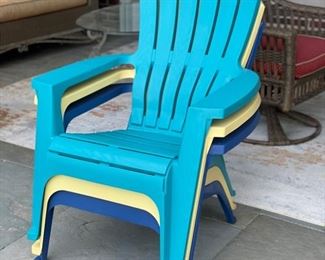 Set of 6 plastic Adirondack chairs.