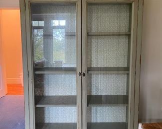 Antique glass front cabinet with wallpaper interior and skeleton key. Measures 57" W x 17" D x 80" H. Photo 1 of 3.