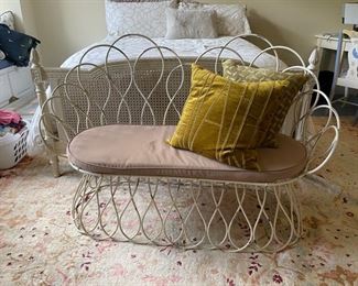 White washed metal settee with cushion. Measures 54" W x 24" D x 18" Seat Height.