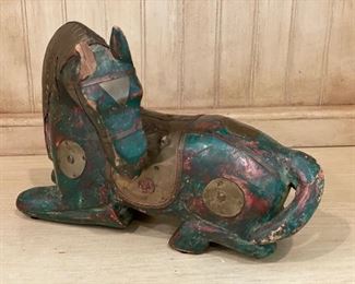 Carved wood horse with brass detailing.