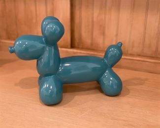 Porcelain balloon dog figurine.