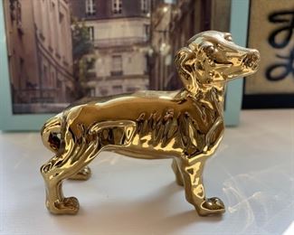 Porcelain dog with gold finish.