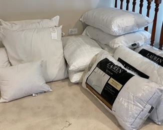 Assorted designer brand down pillows in sizes -- European sham through King.