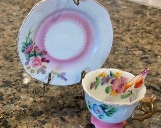 Mini porcelain cup and saucer.