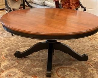 60" D x 29" H dining table with ebony base and walnut top. Photo 1 of 2.