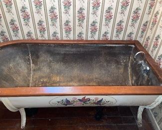 Antique metal and wood bathtub 
