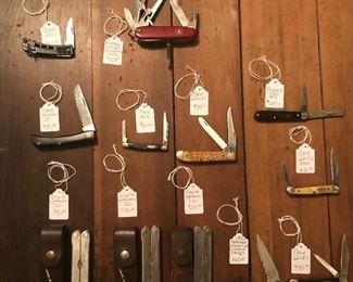Collection of vintage pocket knives and tools by Leatherman, Swiss Army, Case, Buck, Benchmade, and Boker USA. 
