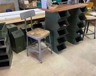 Metal shop storage bins stacked to form legs, wood placed across the top to form a chest or table top, then accessories added for a wine tasting .  Food for thought.  vintage metal stools