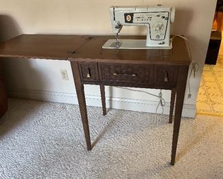 Singer sewing machine with cabinet